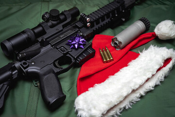 Weapon and Christmas, gnome hat and ar 15 rifle with optical sight and silencer, close-up photo.