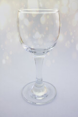 a small glass on a leg on a white isolated background.