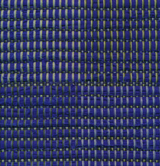 Closeup of handwoven rag rug in green and blue shades.