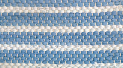 Fototapeta premium Closeup of handwoven rag rug in white and blue shades.