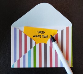Letter envelope with yellow card written - I Need Alone Time - to communicate to partners it is...