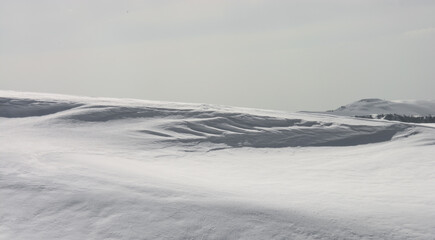background of white snow in the high mountains
