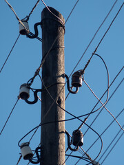 Obraz premium power line. electric pole with wires. old wooden electric pole