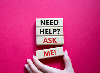 Need help ask me symbol. Concept words Need help ask me on wooden blocks. Beautiful red background....