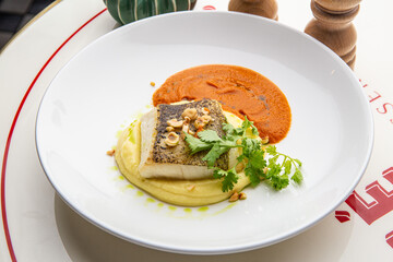 Halibut with mashed potatoes and carrot sauce