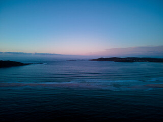 Drone photo of Fingal Bay taken from the Fingal spit, just before sunrise
