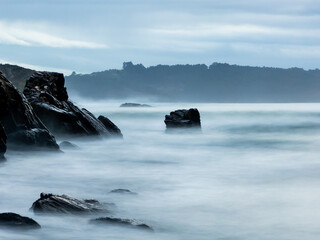 Rocky beach with silky sea water