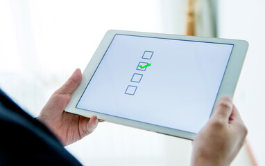 People using digital tablet  voting online