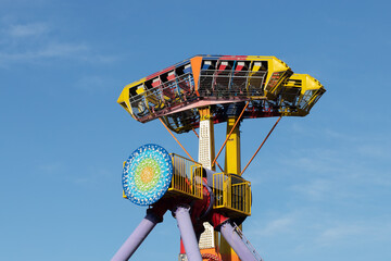 extreme attraction in the amusement park, overturning bus at the fair