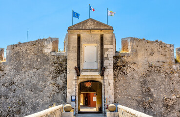 Main gate and defense walls of XVI century Citadel castle in historic old town of Villefranche-sur-Mer resort town in France