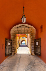 Main gate and defense walls of XVI century Citadel castle in historic old town of Villefranche-sur-Mer resort town in France