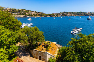 Panoramic view of harbor and yachts offshore Azure Cost of Mediterranean Sea in Villefranche-sur-Mer resort town in France