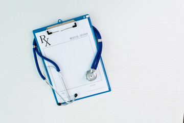 Stethoscope with prescription on table