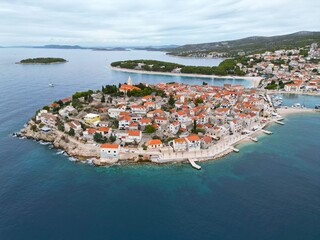 Primosten town Croatia high angle wide shot drone aerial view
