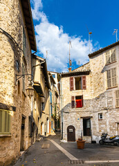 Narrow streets and colorful historic houses of old town quarter with Rue du Portail Levis street in medieval riviera resort of Vence in France
