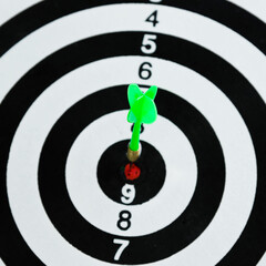 Dart arrow hitting in the target center