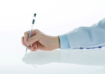 Male doctor hand holding a pen on white background