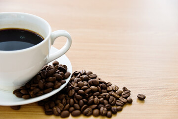 Coffee and beans on wooden table