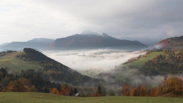 Mountain rural landscape in an autumn foggy morning. The Mala Fatra national park in northwest of Slovakia, Europe. Timelapse footage.