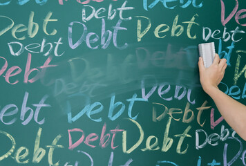 Wiping debt on a chalkboard