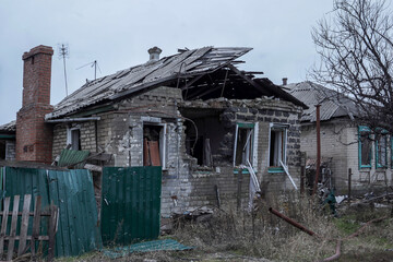 Ruins of house after the bombing in the city of Lyman. War conflict between Ukraine and Russia.