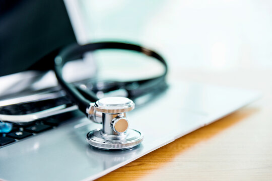 Stethoscope on the keyboard of laptop