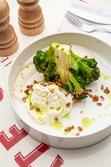 Baked broccoli with sauce and chilli