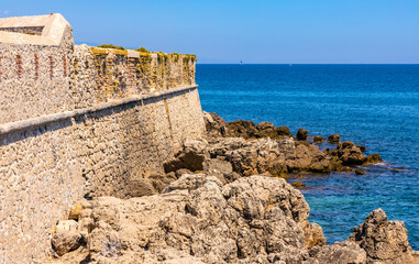 Panoramic view medieval Bastion Saint Jaume fortress walls onshore Azure Cost of Mediterranean Sea...