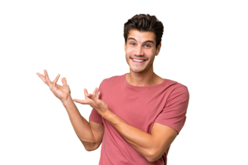 Young handsome caucasian man over isolated background extending hands to the side for inviting to come