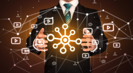 Hand holding social media icons