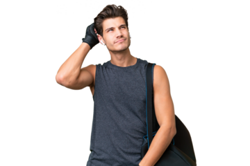 Young sport caucasian man with sport bag over over isolated background having doubts and with confuse face expression