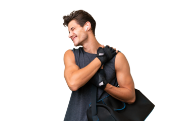 Young sport caucasian man with sport bag over over isolated background suffering from pain in shoulder for having made an effort