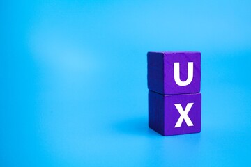 colored cube with the letter UX. User experience concept.