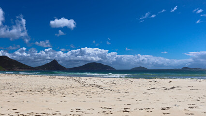 View toward Tomaree Mountain in Port Stephens, taken from the Fingal Spit on a sunny blue sky day
