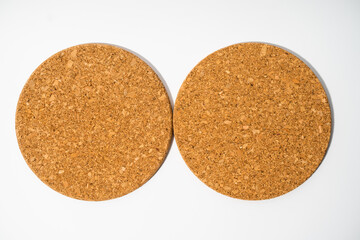 Round cork coaster on a white background for glasses, pots, pans