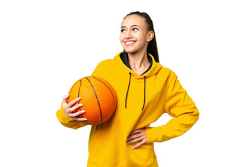 Young Arabian woman playing basketball over isolated wall  over isolated chroma key background...