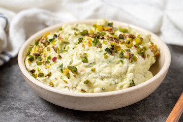 Cretan paste on dark background. Turkish cuisine appetizer flavors. An appetizer made with parsley, grated garlic, pistachios, breadcrumbs, walnuts, spices and olive oil. close up
