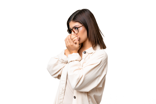 Young Russian woman over isolated chroma key background covering mouth and looking to the side