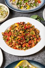 Traditional Turkish and Greek dinner appetizer table. Mediterranean appetizer concept. Dry cowpea salad, roasted eggplant salad, stuffed olives, stuffed peppers, gavurdagi salad