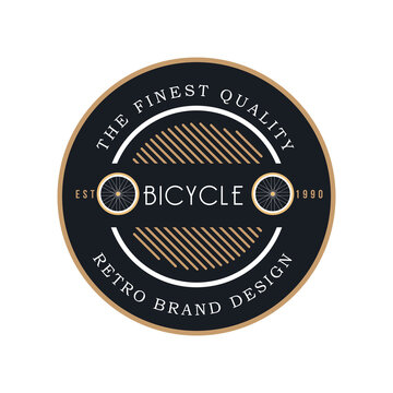 a gear shaped emblem logo for bicycle company depicting a bicycle wheel in gold and black color with text that said the finest quality and retro brand design
