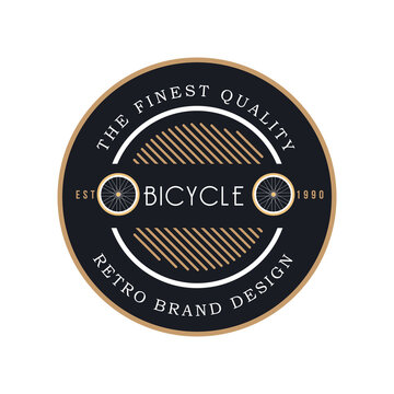 a gear shaped emblem logo for bicycle company depicting a bicycle wheel in gold and black color with text that said the finest quality and retro brand design
