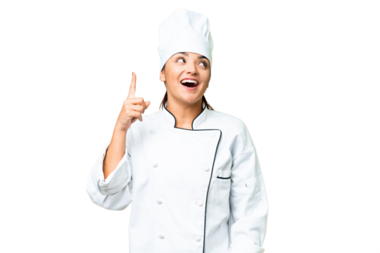 Young woman Chef over isolated chroma key background pointing up and surprised