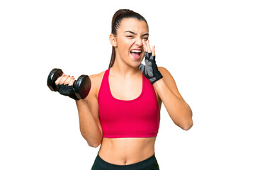 Young sport woman making weightlifting shouting with mouth wide open