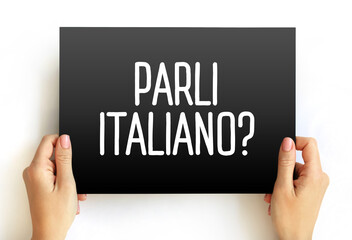 Parli Italiano? (do you speak Italian?) text on card, concept background