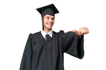 Young university graduate caucasian man over isolated background giving a thumbs up gesture