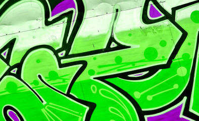 Colorful background of graffiti painting artwork with bright aerosol strips and beautiful colors. Old school street art piece made with aerosol spray paint cans. Contemporary youth culture backdrop