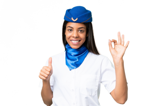 Airplane stewardess African american woman over isolated background showing ok sign and thumb up gesture