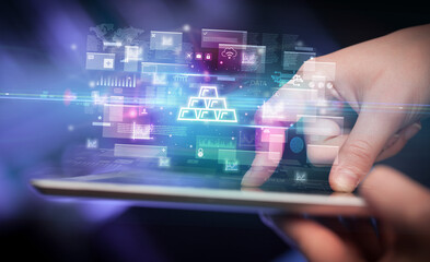 Close-up of a hand using tablet, currency concept