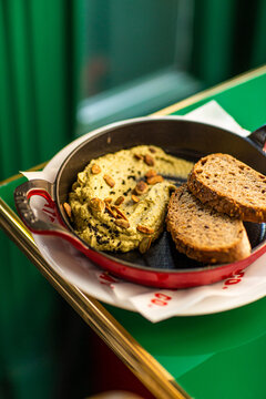 Hummus with baked bread and nuts