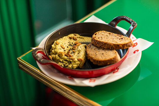 Hummus with baked bread and nuts